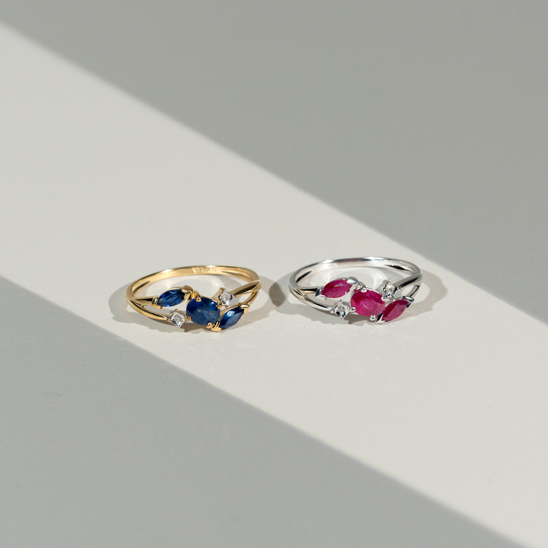 Contemporary Marquise Light Blue Sapphire & Diamond Three Stone Ring in 9ct Yellow Gold