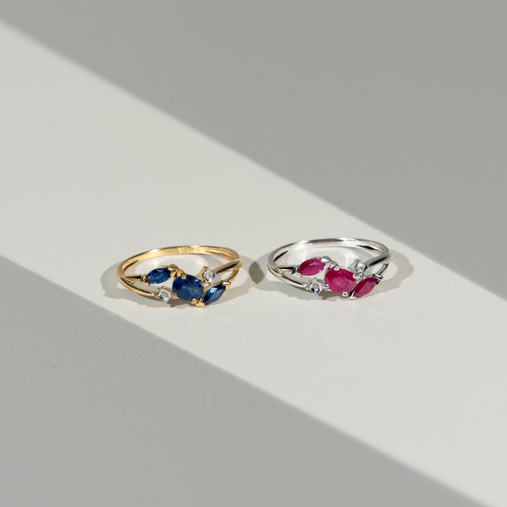 Contemporary Marquise Light Blue Sapphire & Diamond Three Stone Ring in 9ct Yellow Gold