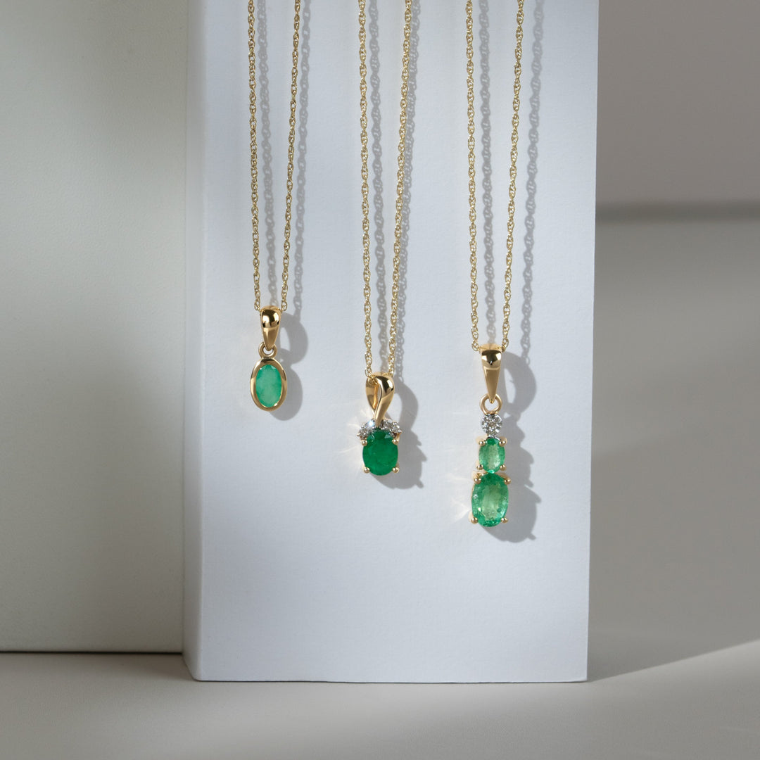 Classic two Oval Emerald & Diamond Pendant in 9ct Yellow Gold
