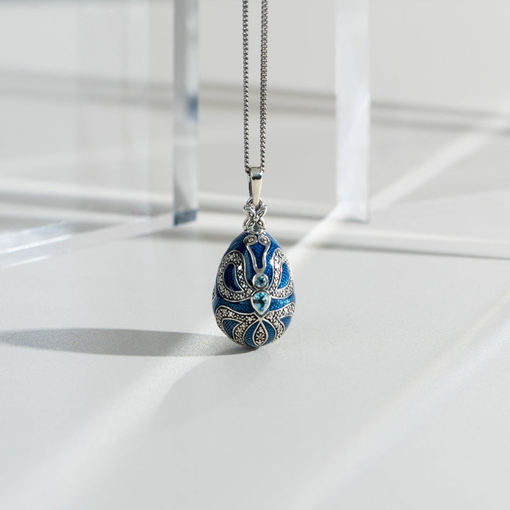 Art Nouveau Style Pear Blue Topaz Egg Pendant flatlay