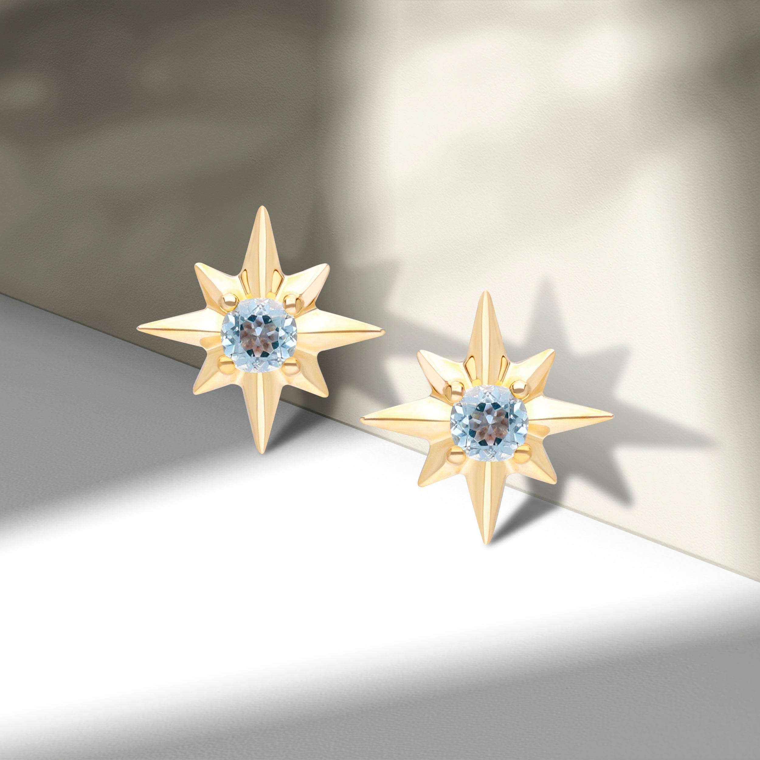 135E1821019 Night Sky Light Swiss Blue Topaz Cabochon Star Stud Earrings in 9ct Yellow Gold On Model